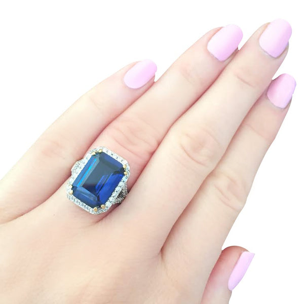 Sterling Silver 8 Carat Sapphire Hued Emerald Cut Ring with 18 KGP Prongs