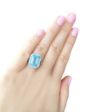 Sterling Silver 8 Carat Blue Topaz Emerald Cut Ring with 18 KGP Prongs